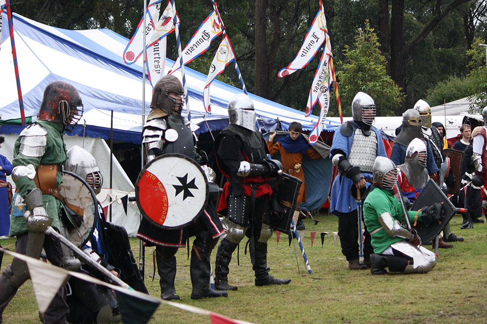  a line of armored knights waiting to fight