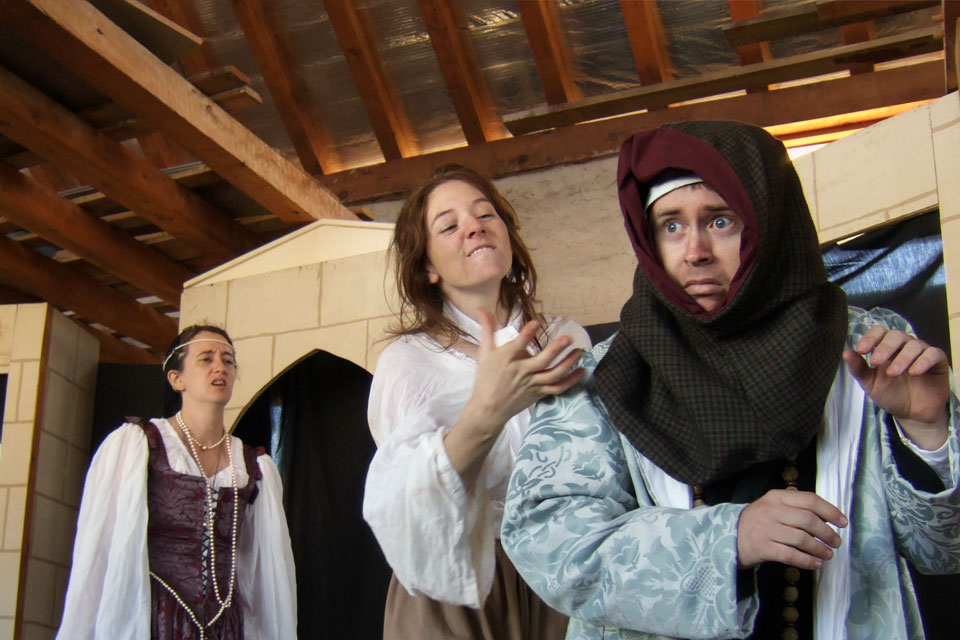 people performing in a medieval play